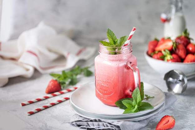 strawberry milk yogurt smoothies beautiful red glass jar sprigs mint white concrete table 127032 642
